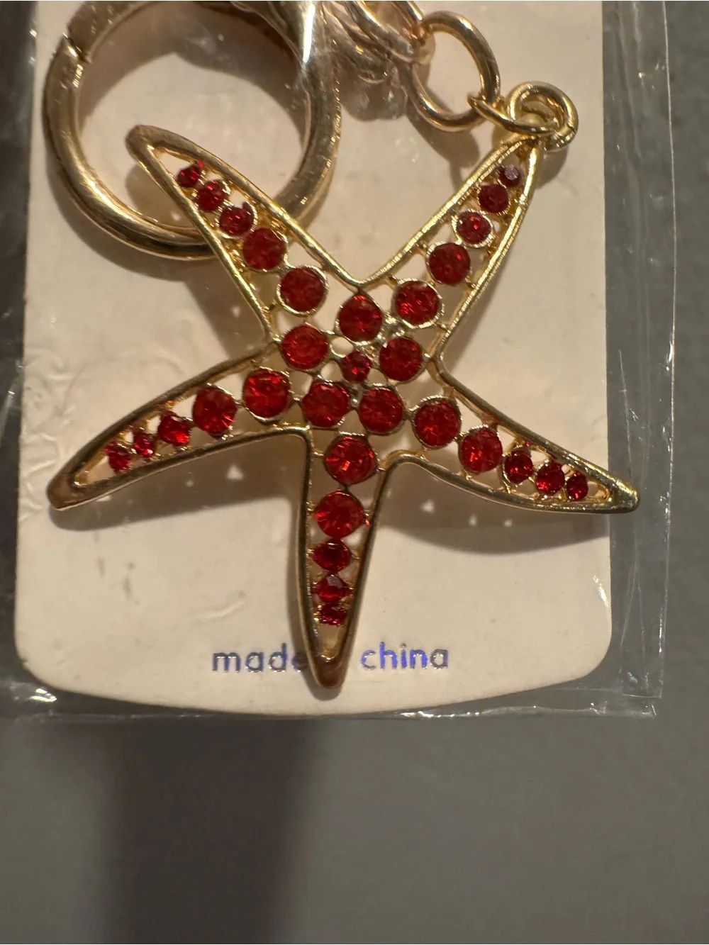 Starfish Gold-Tone Keychain with Red Sparkling Accents